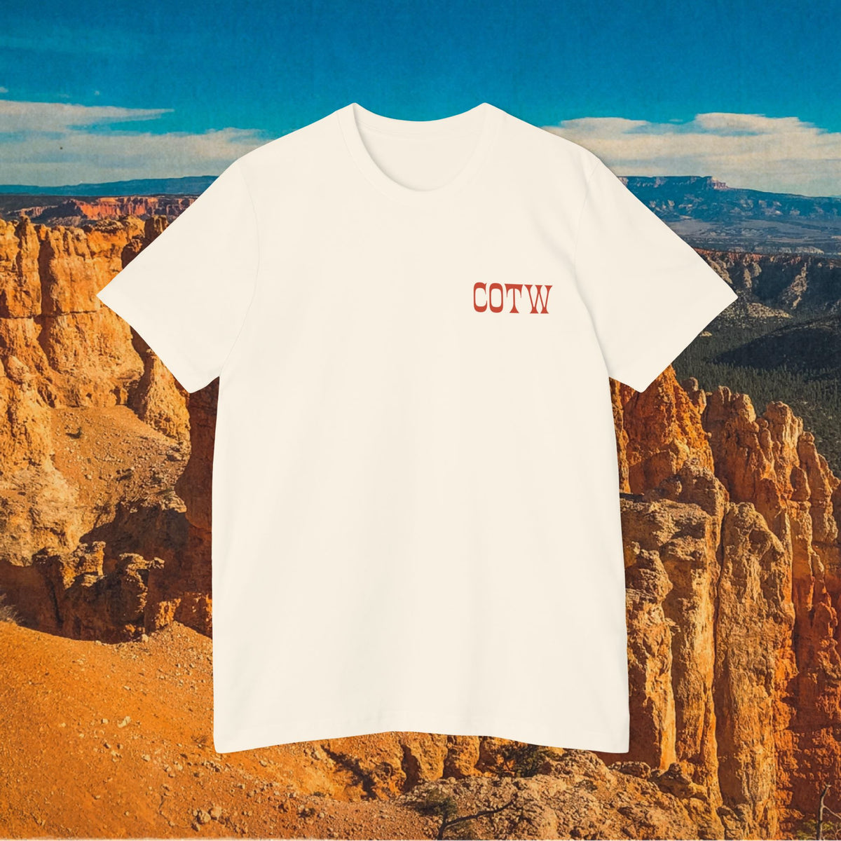 Natural Talkin’ Less Says More shirt showing its small red COTW chest print