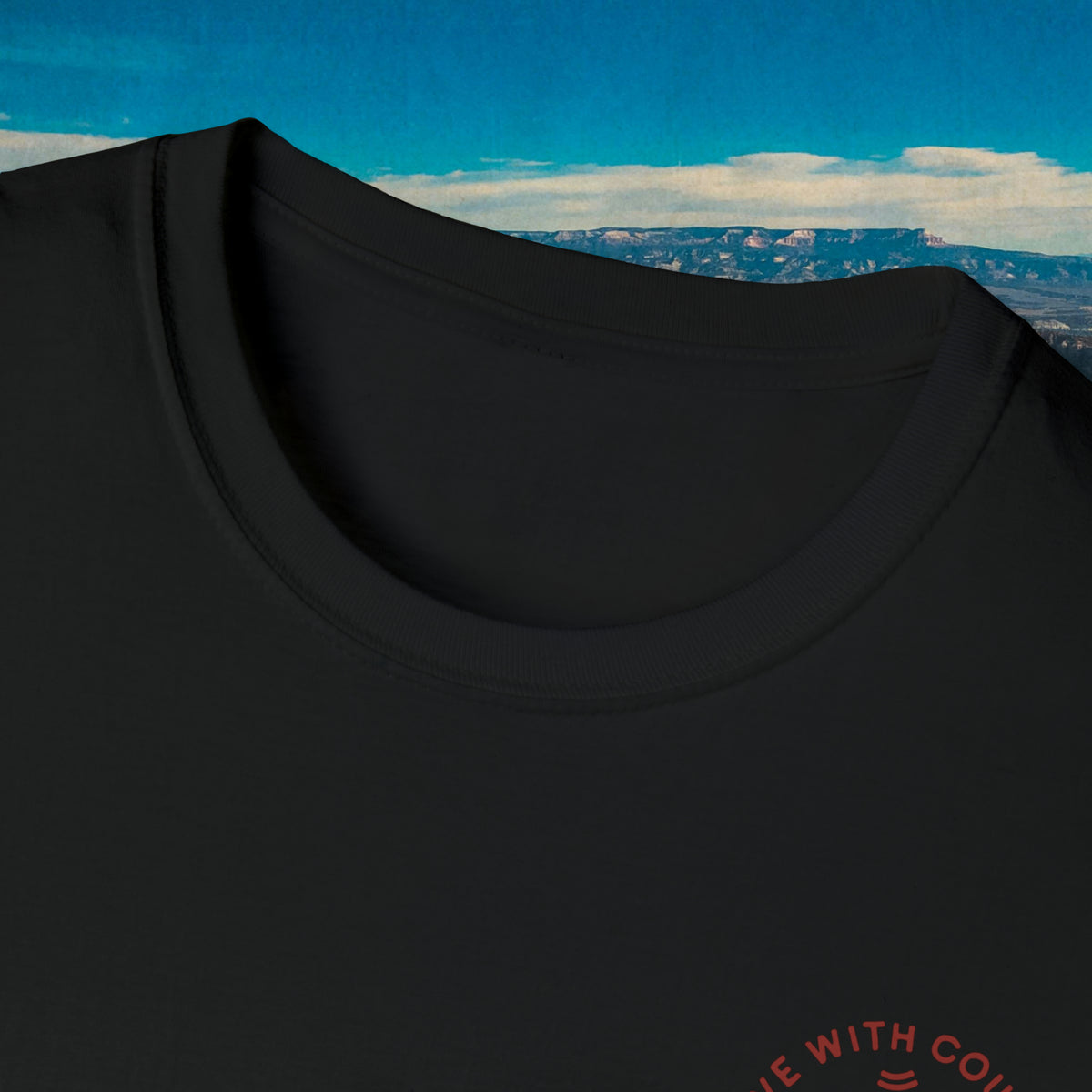 Close-up of the black Let Him Buck shirt neckline