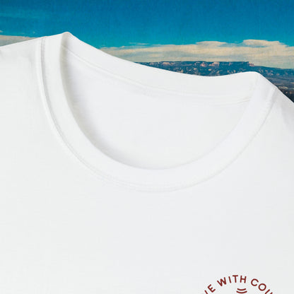 Close-up of the white Let Him Buck shirt neckline and chest mark
