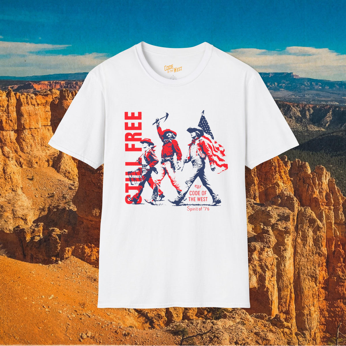 White Spirit of ’76 T-shirt with red and blue cowboy trio and Still Free lettering