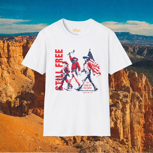 White Spirit of ’76 T-shirt with red and blue cowboy trio and Still Free lettering