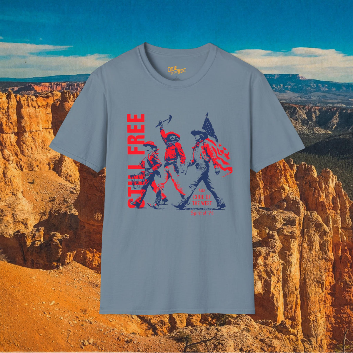 Stone blue Spirit of ’76 T-shirt with cowboy trio and Still Free lettering