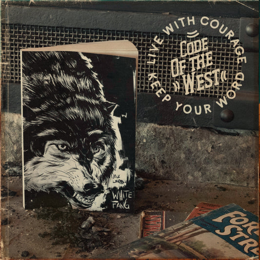 White Fang Code of the West Library edition displayed beside a black COTW cap