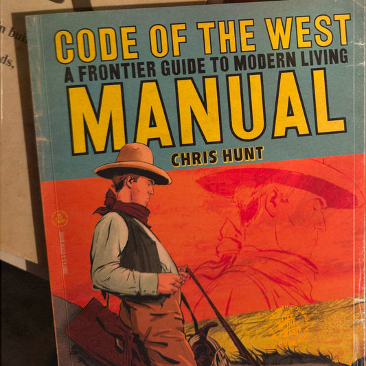 Code of the West Manual by Chris Hunt, with orange western illustration on the front cover