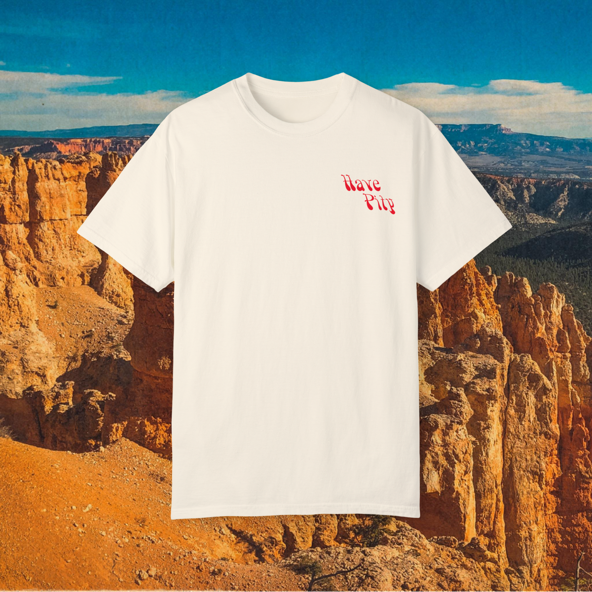 Natural Have Pity on a Dinosaur shirt showing its small red chest graphic