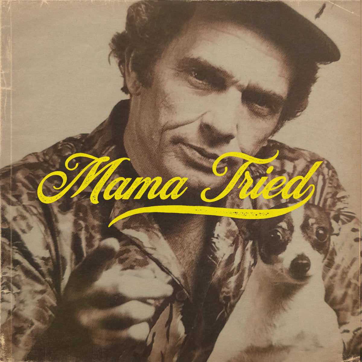 Vintage portrait of a man in a patterned shirt with yellow Mama Tried lettering