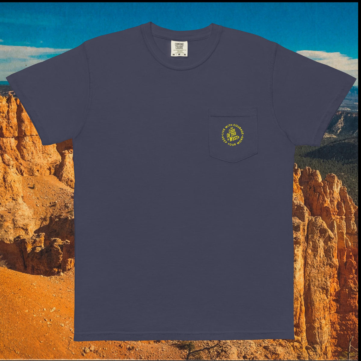 Dark blue Dad’s Pocket Tee with a small gold COTW mark on the chest pocket