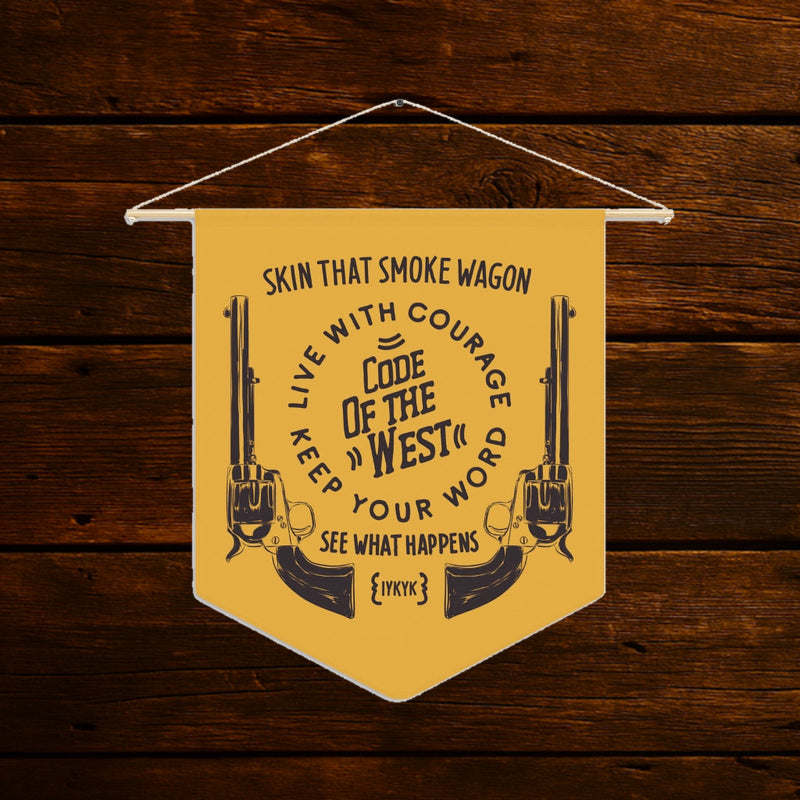Gold Smoke Wagon wall pennant with black lettering, revolver drawings and a wooden hanging dowel