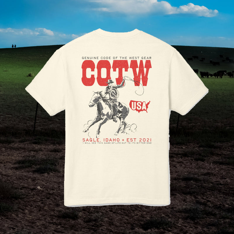 Faded cream Western Grit T-shirt with red COTW lettering and a cowboy on horseback