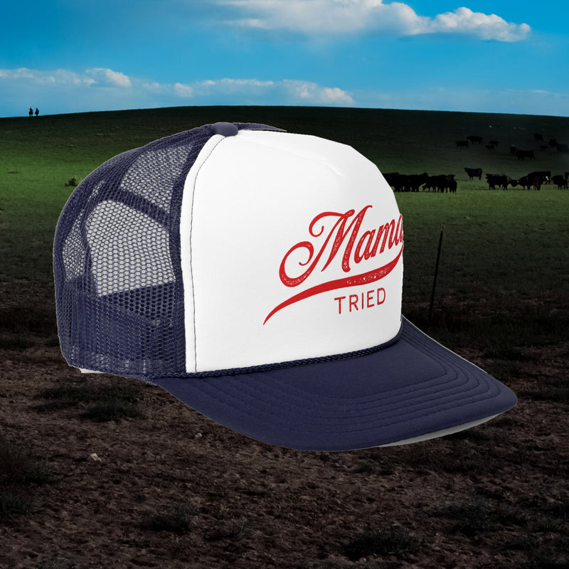 Mama Tried trucker hat in navy with white front and red script, angled view