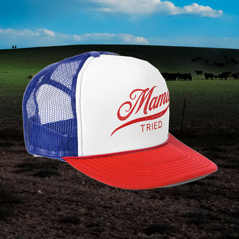 Mama Tried trucker hat in blue and red with white front and red script, angled view