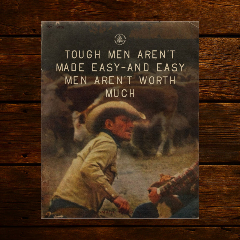 Tough Men Aren’t Made Easy print with a seated cowboy beneath white lettering
